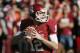 NORMAN, OK - NOVEMBER 24: Quarterback Landry Jones #12 of the Oklahoma Sooners looks to throw against the Oklahoma State Cowboys November 24, 2012 at Gaylord Family-Oklahoma Memorial Stadium in Norman, Oklahoma. Oklahoma defeated Oklahoma State 51-48 in overtime. (Photo by Brett Deering/Getty Images)