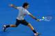 MELBOURNE, AUSTRALIA - JANUARY 17: Roger Federer of Switzerland plays a backhand in his second round match against Nikolay Davydenko of Russia during day four of the 2013 Australian Open at Melbourne Park on January 17, 2013 in Melbourne, Australia. (Photo by Quinn Rooney/Getty Images)