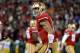 SAN FRANCISCO, CA - JANUARY 12: Quarterback Colin Kaepernick #7 of the San Francisco 49ers celebrates a touchdown against the Green Bay Packers during the NFC Divisional Playoff Game at Candlestick Park on January 12, 2013 in San Francisco, California. (Photo by Harry How/Getty Images)