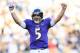 Nov 11, 2012; Baltimore, MD, USA; Baltimore Ravens quarterback Joe Flacco (5) celebrates after throwing a touchdown pass in the third quarter against the Oakland Raiders at M&T Bank Stadium. Baltimore defeated Oakland 55-20. Mandatory Credit: James Lang-USA TODAY Sports
