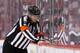 GLENDALE, AZ - JANUARY 20: Referee Frederick L'Ecuyer waits for a goal to be reviewed during the NHL game between the Chicago Blackhawks and Phoenix Coyotes at Jobing.com Arena on January 20, 2013 in Glendale, Arizona. The Blackhawks defeated the Coyotes 6-4. (Photo by Christian Petersen/Getty Images)