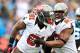 CHARLOTTE, NC - NOVEMBER 18: Da'Quan Bowers #91 and Gerald McCoy #93 of the Tampa Bay Buccaneers celebrate after Bowers' sack of quarterback Cam Newton #1 of the Carolina Panthers during play at Bank of America Stadium on November 18, 2012 in Charlotte, North Carolina. (Photo by Grant Halverson/Getty Images)