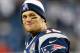 FOXBORO, MA - DECEMBER 10: Tom Brady #12 of the New England Patriots smiles from the sideline in the fourth quarter against the Houston Texans at Gillette Stadium on December 10, 2012 in Foxboro, Massachusetts. (Photo by Jim Rogash/Getty Images)