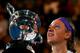 MELBOURNE, AUSTRALIA - JANUARY 26: Victoria Azarenka of Belarus poses with the Daphne Akhurst Memorial Cup after winning her women's final match against Na Li of China during day thirteen of the 2013 Australian Open at Melbourne Park on January 26, 2013 in Melbourne, Australia. (Photo by Ryan Pierse/Getty Images)