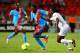 PORT ELIZABETH, SOUTH AFRICA - JANUARY 24: Deogracias Kanda (L) and Dieudonne Mbokani Bezua of DR Congo in action against Mohamed Chicoto of Niger during the 2013 African Cup of Nations match between Niger and DR Congo at Nelson Mandela Bay Stadium on January 24, 2013 in Port Elizabeth, South Africa. (Photo by Richard Huggard/Gallo Images/Getty Images)
