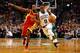 BOSTON, MA - JANUARY 11: Rajon Rondo #9 of the Boston Celtics carries the ball past Toney Douglas #15 of the Houston Rockets during the game on January 11, 2013 at TD Garden in Boston, Massachusetts. NOTE TO USER: User expressly acknowledges and agrees that, by downloading and or using this photograph, User is consenting to the terms and conditions of the Getty Images License Agreement. (Photo by Jared Wickerham/Getty Images)