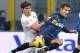 MILAN, ITALY - DECEMBER 02: Philippe Coutinho (R) of Inter and Ezequiel Munoz of Palermo compete for the ball during the Serie A match between FC Internazionale Milano and US Citta di Palermo at San Siro Stadium on December 2, 2012 in Milan, Italy. (Photo by Tullio M. Puglia/Getty Images)