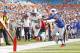 MIAMI GARDENS, FL - DECEMBER 23: Reggie Bush #22 of the Miami Dolphins reaches out as he scores his first of three touchdowns against the Buffalo Bills on December 23, 2012 at Sun Life Stadium in Miami Gardens, Florida. The Dolphins defeated the Bills 24-10. (Photo by Joel Auerbach/Getty Images)