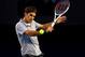 MELBOURNE, AUSTRALIA - JANUARY 25: Roger Federer of Switzerland plays a backhand in his semifinal match against Andy Murray of Great Britain during day twelve of the 2013 Australian Open at Melbourne Park on January 25, 2013 in Melbourne, Australia. (Photo by Julian Finney/Getty Images)