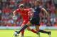LIVERPOOL, ENGLAND - SEPTEMBER 02: Joe Allen of Liverpool is challenged by Kieran Gibbs of Arsenal during the Barclays Premier League match between Liverpool and Arsenal at Anfield on September 2, 2012 in Liverpool, England. (Photo by Alex Livesey/Getty Images)