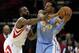 Jan 23, 2013; Houston, TX, USA; Denver Nuggets shooting guard Andre Iguodala (9) controls the ball as Houston Rockets shooting guard James Harden (13) defends during the second quarter at Toyota Center. Mandatory Credit: Troy Taormina-USA TODAY Sports