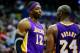 December 14, 2012; Washington, DC, USA; Los Angeles Lakers center Dwight Howard (12) talks with Lakers shooting guard Kobe Bryant (24) against the Washington Wizards at Verizon Center. Mandatory Credit: Geoff Burke-USA TODAY Sports