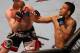 Nov 17, 2012; Montreal, QC, Canada; Rafael dos Anjos (right) punches Mark Bocek during their Lightweight bout at UFC 154 at the Bell Centre. Mandatory Credit: Tom Szczerbowski-USA TODAY Sports