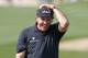 SCOTTSDALE, AZ - JANUARY 31: Phil Mickelson reacts after missing his birdie putt on the ninth hole that would have given him a round of 59 during the first round of the Waste Management Phoenix Open at TPC Scottsdale on January 31, 2013 in Scottsdale, Arizona. (Photo by Hunter Martin/Getty Images)