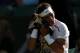 LONDON, ENGLAND - JUNE 28: Rafael Nadal of SPain wipes his face with a towel during his Gentlemen's Singles second round match against Lukas Rosol of the Czech Republic on day four of the Wimbledon Lawn Tennis Championships at the All England Lawn Tennis and Croquet Club on June 28, 2012 in London, England. (Photo by Clive Rose/Getty Images)