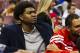 Oct 17, 2012; Philadelphia, PA, USA; Philadelphia 76ers center Andrew Bynum (33) (in street cloths) sits next to center Dan Gadzuric (14) at the end of the bench during the third quarter against the Cleveland Cavaliers at the Wachovia Center. The Sixers defeated the Cavaliers 113-99. Mandatory Credit: Howard Smith-USA TODAY Sports