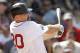 BOSTON, MA - JUNE 24: Kevin Youkilis #20 of the Boston Red Sox follows through on a hit during the interleague game against the Atlanta Braves at Fenway Park on June 23, 2012 in Boston, Massachusetts. (Photo by Winslow Townson/Getty Images)