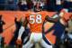 DENVER, CO - DECEMBER 2: Von Miller #58 of the Denver Broncos celebrates after scoring a touchdown on an intercepting during the game against the Tampa Bay Buccaneers at Sports Authority Field at Mile High on December 2, 2012 in Denver, Colorado. (Photo by Garrett W. Ellwood/Getty Images)