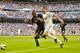 MADRID, SPAIN - SEPTEMBER 02: Cristiano Ronaldo of Real Madrid competes for the ball with Adam Romero Nyom (L) of Granada during the La Liga match between Real Madrid and Granada at Estadio Santiago Bernabeu on September 2, 2012 in Madrid, Spain. (Photo by Gonzalo Arroyo Moreno/Getty Images)