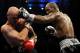 ATLANTIC CITY, NJ - OCTOBER 18: Bernard Hopkins of Philadelphia, Pennsylvania (R) connects with a jab to Kelly Pavlik of Youngstown, Ohio during their light heavyweight bout at Boardwalk Hall on October 18, 2008 in Atlantic City, New Jersey. (Photo by Jeff Zelevansky/Getty Images)