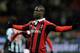 MILAN, ITALY - FEBRUARY 03: Mario Balotelli of AC Milan celebrates after scoring his second goal from the penalty spot during the Serie A match between AC Milan and Udinese Calcio at San Siro Stadium on February 3, 2013 in Milan, Italy. (Photo by Claudio Villa/Getty Images)