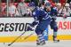 TORONTO, CANADA - JANUARY 31: Dion Phaneuf #3 of the Toronto Maple Leafs skates with the puck in a game against the Washington Capitals on January 31, 2013 at the Air Canada Centre in Toronto, Canada. The Leafs defeated the Capitals 3-2. (Photo by Claus Andersen/Getty Images)
