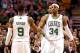 Dec 19, 2012; Boston, MA, USA; Boston Celtics point guard Rajon Rondo (9) and small forward Paul Pierce (34) celebrate against the Cleveland Cavaliers during the first half at TD Garden. Mandatory Credit: Mark L. Baer-USA TODAY Sports