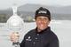 PEBBLE BEACH, CA - FEBRUARY 12: Phil Mickelson celebrates with the tournament trophy after winning with an eight-under-par 64 during the AT&T Pebble Beach National Pro-Am at Pebble Beach Golf Links on February 12, 2012 in Pebble Beach, California. (Photo by Ezra Shaw/Getty Images)