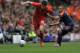 LIVERPOOL, ENGLAND - AUGUST 12: Martin Kelly (L) of Liverpool and Sidney Sam (R) of Bayer Leverkusen battle for the ball during the pre season friendly match between Liverpool and Bayer Leverkusen at Anfield on August 12, 2012 in Liverpool, England. (Photo by Clint Hughes/Getty Images)