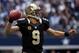 ARLINGTON, TX - DECEMBER 23: Quarterback Drew Brees #9 of the New Orleans Saints looks for an open receiver against the Dallas Cowboys at Cowboys Stadium on December 23, 2012 in Arlington, Texas. (Photo by Tom Pennington/Getty Images)