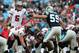 CHARLOTTE, NC - NOVEMBER 18: Josh Freeman #5 of the Tampa Bay Buccaneers points across the line as Luke Kuechly #59 of the Carolina Panthers points back during their game at Bank of America Stadium on November 18, 2012 in Charlotte, North Carolina. (Photo by Streeter Lecka/Getty Images)