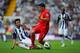 WEST BROMWICH, ENGLAND - AUGUST 18: Luis Suarez of Liverpool is tackled by Claudio Yacob (L) of West Brom during the Barclays Premier League match between West Bromwich Albion and Liverpool at The Hawthorns on August 18, 2012 in West Bromwich, England. (Photo by Michael Regan/Getty Images)