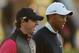 ABU DHABI, UNITED ARAB EMIRATES - JANUARY 17: Rory McIlroy of Northern Ireland (L) and Tiger Woods of the USA walk up the fairway on the tenth hole during the first round of the Abu Dhabi HSBC Golf Championship at Abu Dhabi Golf Club on January 17, 2013 in Abu Dhabi, United Arab Emirates. (Photo by Scott Halleran/Getty Images)