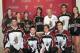 Roper (right) donning number 7 as Stingers celebrate announcement of new arena (Image obtained from Women's Hockey Life)