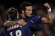 Ezequiel Lavezzi celebrates his goal against Valencia with teammate Zlatan Ibrahomovic.