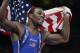 Aug 10, 2012; London, United Kingdom; Jordan Burroughs (USA) celebrates after defeating Sadegh Saeed Goudarzi (IRI) and winning the gold in the men's freestyle 74 kg gold medal match during the London 2012 Olympic Games at ExCeL - North Arena 2. Mandatory Credit: Richard Mackson-USA TODAY Sports