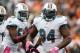 CINCINNATI, OH - OCTOBER 07: Defensive tackle Randy Starks #94 of the Miami Dolphins celebrates after an interception with Karlos Dansby #58 against the Cincinnati Bengals at Paul Brown Stadium on October 7, 2012 in Cincinnati, Ohio. (Photo by Matt Sullivan/Getty Images)