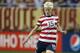 DETROIT, MI - DECEMBER 08: Megan Rapinoe #15 of Team USA dribbles the ball during the game against China at Ford Field on December 8, 2012 in Detroit, Michigan. USA defeated China 2-0. (Photo by Leon Halip/Getty Images)