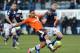 LUTON, ENGLAND - FEBRUARY 16: Andre Gray of Luton Town breaks away from Shane Lowry of Millwall FC during the FA Cup with Budweiser Fifth Round Match between Luton Town and Millwall FC at Kenilworth Road on February 16, 2013 in Luton, England. (Photo by Steve Bardens/Getty Images)