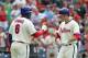 PHILADELPHIA - JULY 21: Second baseman Chase Utley #26 of the Philadelphia Phillies is greeted by first baseman Ryan Howard #6 after hitting solo home run during a game against the San Francisco Giants at Citizens Bank Park on July 21, 2012 in Philadelphia, Pennsylvania. (Photo by Hunter Martin/Getty Images)