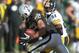 Sep 23, 2012; Oakland, CA, USA; Oakland Raiders linebacker Philip Wheeler (52) recovers a fumble by Pittsburgh Steelers receiver Antonio Brown (84) at the O.co Coliseum. The Raiders defeated the Steelers 34-31. Mandatory Credit: Kirby Lee/Image of Sport-USA TODAY Sports