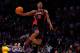 HOUSTON, TX - FEBRUARY 16: Terrence Ross of the Toronto Raptors jumps over a ball kid in his final dunk during the Sprite Slam Dunk Contest part of 2013 NBA All-Star Weekend at the Toyota Center on February 16, 2013 in Houston, Texas. NOTE TO USER: User expressly acknowledges and agrees that, by downloading and or using this photograph, User is consenting to the terms and conditions of the Getty Images License Agreement. (Photo by Scott Halleran/Getty Images)