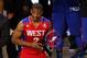 Feb 17, 2013; Houston, TX, USA; Western Conference guard Chris Paul (3) of the Los Angeles Clippers is awarded the MVP trophy for the 2013 NBA All-Star Game at the Toyota Center. Mandatory Credit: Brett Davis-USA TODAY Sports
