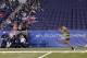 INDIANAPOLIS, IN - FEBRUARY 28: Scouts look on as a player runs the 40-yard dash during the 2012 NFL Combine at Lucas Oil Stadium on February 28, 2012 in Indianapolis, Indiana. (Photo by Joe Robbins/Getty Images)