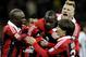 MILAN, ITALY - FEBRUARY 03: Mario Balotelli (C) of AC Milan celebrates with team-mates after scoring his second goal from the penalty spot during the Serie A match between AC Milan and Udinese Calcio at San Siro Stadium on February 3, 2013 in Milan, Italy. (Photo by Claudio Villa/Getty Images)