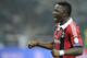 MILAN, ITALY - FEBRUARY 20: Sulley Muntari of AC Milan celebrates victory at the end of the UEFA Champions League Round of 16 first leg match between AC Milan and Barcelona at San Siro Stadium on February 20, 2013 in Milan, Italy. (Photo by Claudio Villa/Getty Images)