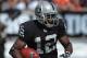 Oct 16, 2011; Oakland, CA, USA; Oakland Raiders receiver Jacoby Ford (12) scores on a 101-yard kickoff return in the second quarter against the Cleveland Browns at the O.co Coliseum. The Raiders defeated the Browns 24-17. Mandatory Credit: Kirby Lee/Image of Sport-USA TODAY Sports