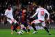 BARCELONA, SPAIN - FEBRUARY 23: Lionel Messi of FC Barcelona (C) duels for the ball with Baba Diawara (L) and Hedwiges Maduro of Sevilla FC during the La Liga match between FC Barcelona and Sevilla FC at Camp Nou on February 23, 2013 in Barcelona, Spain. (Photo by David Ramos/Getty Images)