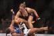 ANAHEIM, CA - FEBRUARY 23: Ronda Rousey hits Liz Carmouche during their UFC Bantamweight Title fight at Honda Center on February 23, 2013 in Anaheim, California. (Photo by Jeff Gross/Getty Images)