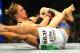 Feb 23, 2013; Anaheim, CA, USA; Ronda Rousey (black shorts) and Liz Carmouche (white shorts) fight during their UFC women's world bantamweight championship bout at the Honda Center. Mandatory Credit: Jayne Kamin-Oncea-USA TODAY Sports